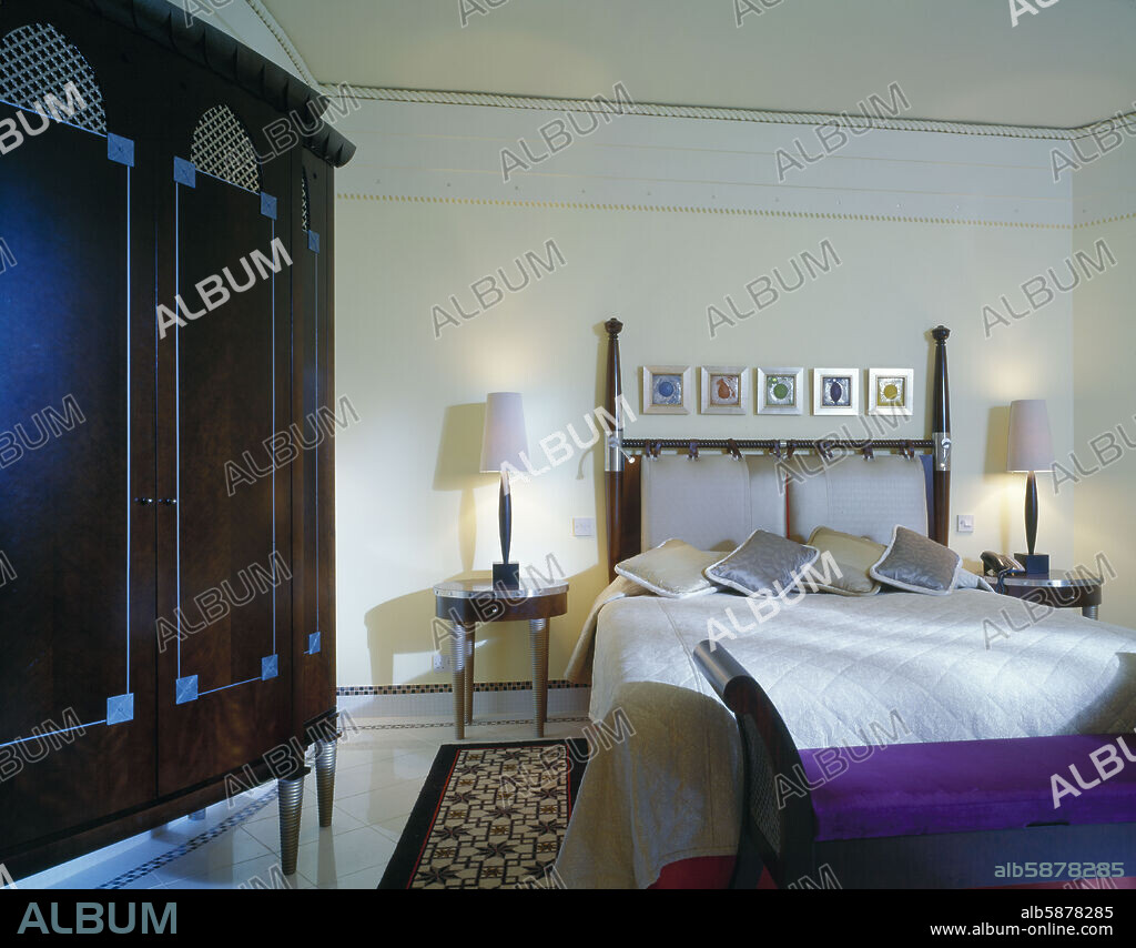 CORINTHIA BAB AFRICA HOTEL BED AND BEDSIDE TABLES WITH LAMPS.