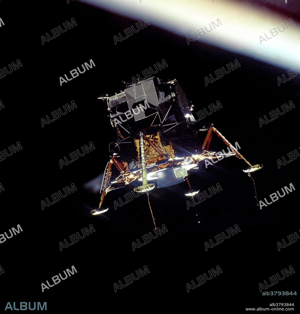 The Apollo 11 Lunar Module (LM) "Eagle", in a landing configuration is photographed in lunar orbit from the Command and Service Modules (CSM) "Columbia". Inside the LM are Commander, Neil A. Armstrong, and Lunar Module Pilot Edwin E. "Buzz" Aldrin Jr. The long "rod-like" protrusions under the landing pods are lunar surface sensing probes. Upon contact with the lunar surface, the probes send a signal to the crew to shut down the descent engine. 07/20/1969.