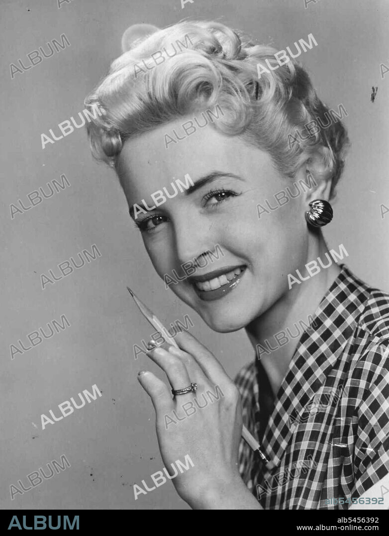 Shell-like earrings conceal the receiver of the latest in hearing aids. September 06, 1954. (Photo by Australian International Press Agency).