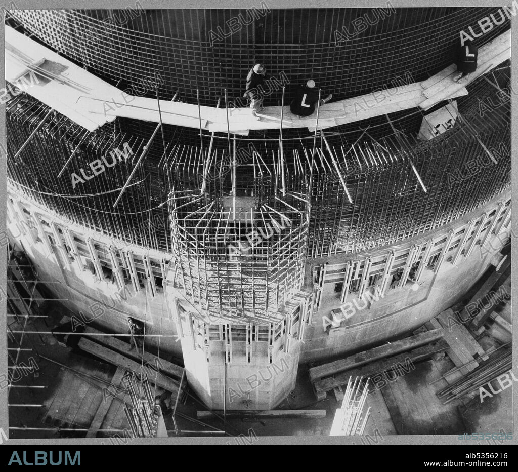 JOHN LAING PLC. Looking down at the east side of Reactor No.1 during the construction of Berkeley Nuclear Power Station, showing the biological shield and its discharge shaft with a Laing team working above. Berkeley Nuclear Power Station was the first commercial nuclear power station in the United Kingdom and one of the first generation of nuclear reactors in Britain. It had two Magnox reactors and was one of four stations located close to the mouth of the River Severn and the Bristol Channel. Laing were the civil engineers for the project with work commencing on 7th January 1957. The nuclear power station came into service in 1962 but has since been decommissioned following its closure in 1989.