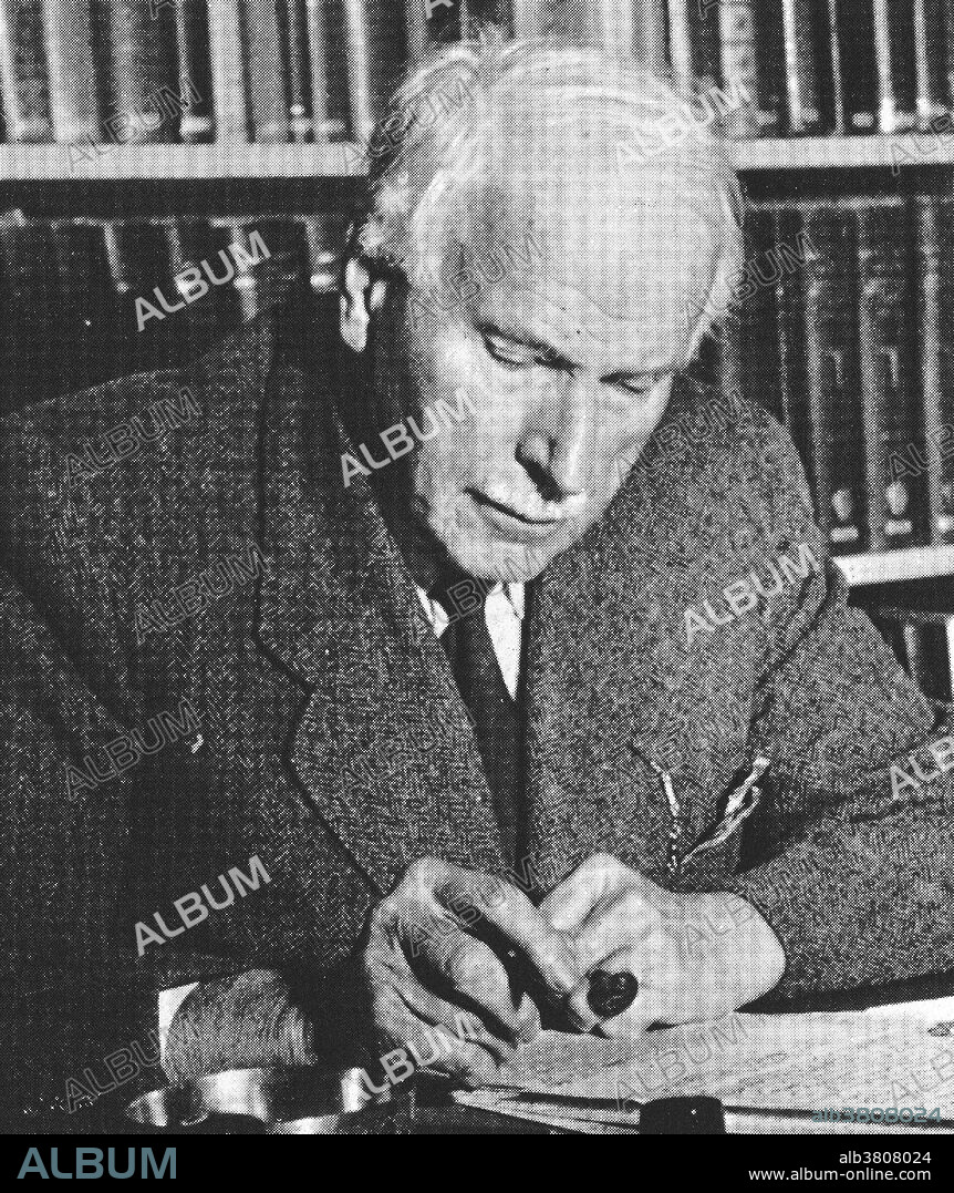 Dr. Carl Gustav Jung, (1875-1961) Swiss psychiatrist and founder of analytical psychology, writing at his desk.