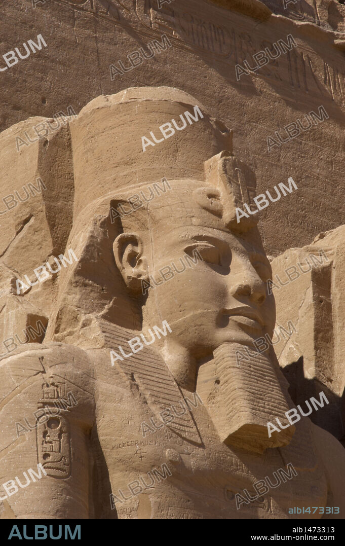 Egyptian art. Great Temple of Ramses II. Colossal statues depicting the pharaoh Ramses II (1290-1224 BC) seated with the nemes head and surmounted by the double crown. 19th Dynasty. New Kingdom.  Abu Simbel. Egypt.
