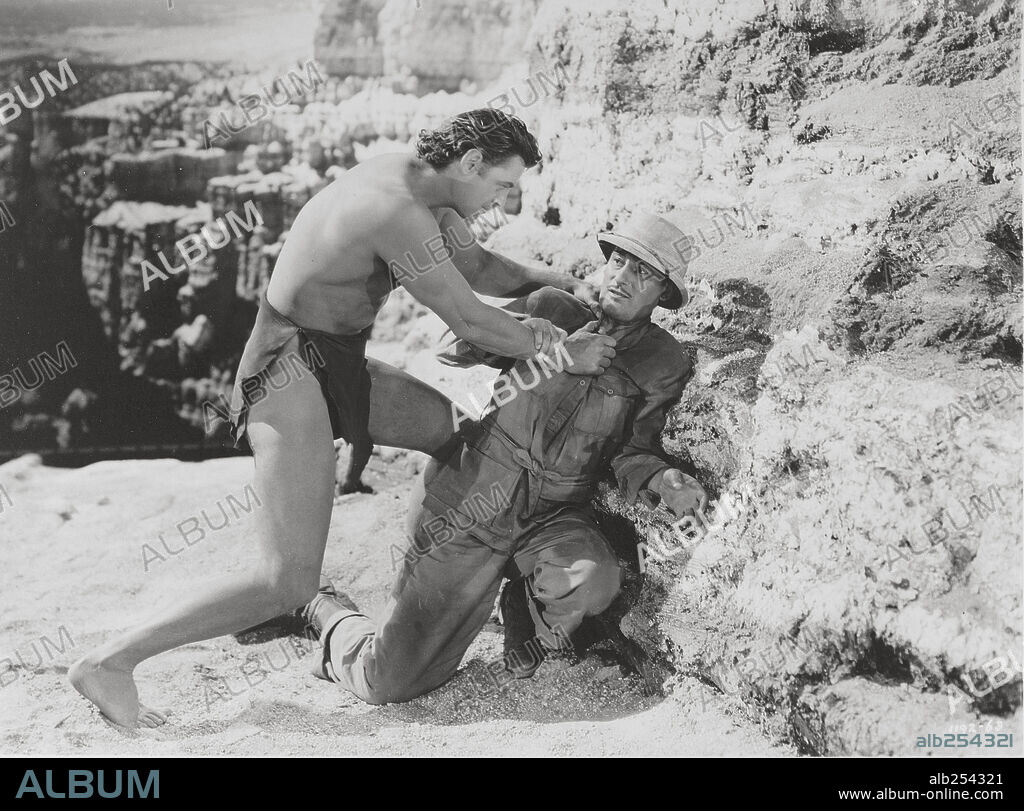 JOHNNY WEISSMULLER and TOM CONWAY in TARZAN'S SECRET TREASURE, 1941, directed by RICHARD THORPE. Copyright M.G.M.