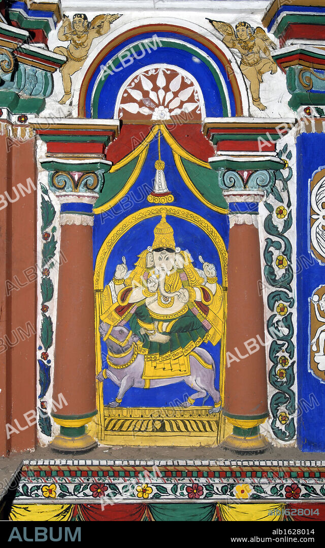 Lord Ganesha seated on Mouse (rat) vahana.  150 year old Mural (vegetable dye) and stucco work on the interior wall of the temple choultry at Pillaiyarpatti, Tamil Nadu, India. Artist Unknown.