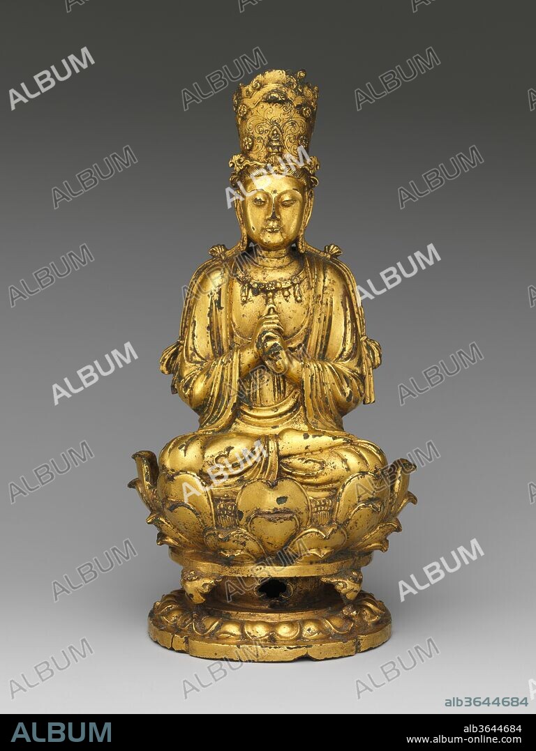 Buddha Vairocana (Dari). Culture: China. Dimensions: H. 8 5/8 in. (21.9 cm); W. 4 3/8 in. (11.1 cm); D. 4 1/4 in. (10.8 cm); Diam. of base 3 3/4 in. (9.5 cm). Date: 11th century.
This Buddha holds his hands in a "wisdom fist," a gesture in which the left hand grasps the index finger of the right hand. This identifies him as Vairocana, one of the  many celestial, or transcendent, Buddhas who were particularly important in China from the sixth through tenth centuries. Vairocana often makes this gesture when he is depicted at the center of the Womb World Mandala, and it is possible that this beautifully cast sculpture was once part of a larger grouping of images arranged as a mandala, or cosmic diagram.