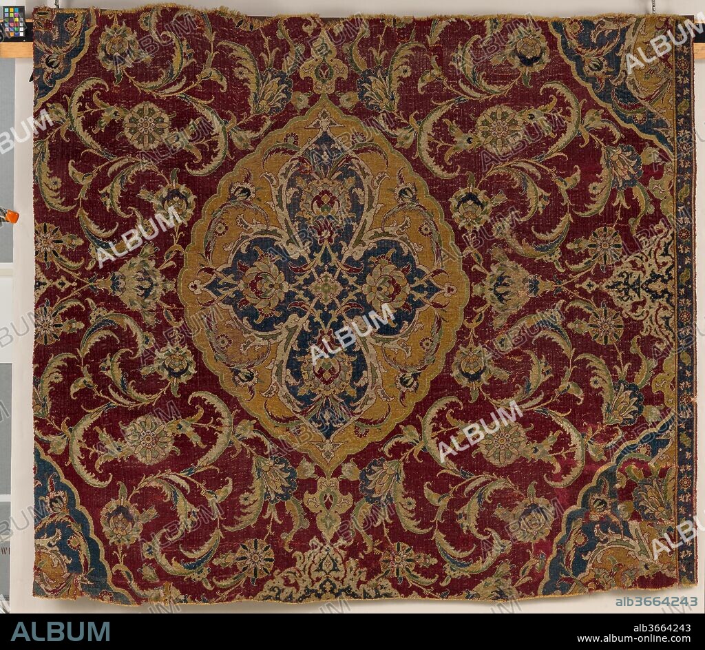 Fragment of an Ottoman Court Carpet. Dimensions: Rug: L. 62 in. (157.5 cm)
W. 69 1/4 in. (175.9 cm)
 Wt. 21lbs. (9.5 kg) with cradle. Date: last quarter 16th century.
Although Mamluk Cairo fell to the Ottomans in 1517, the city continued to be a major center for artistic production. Using the same materials and techniques as earlier Mamluk carpets, Ottoman court carpets such as this were produced in Egypt for export, primarily to the Ottoman court in Istanbul. The immense scale of this carpet's drawing suggests it once formed part of an even larger carpet.