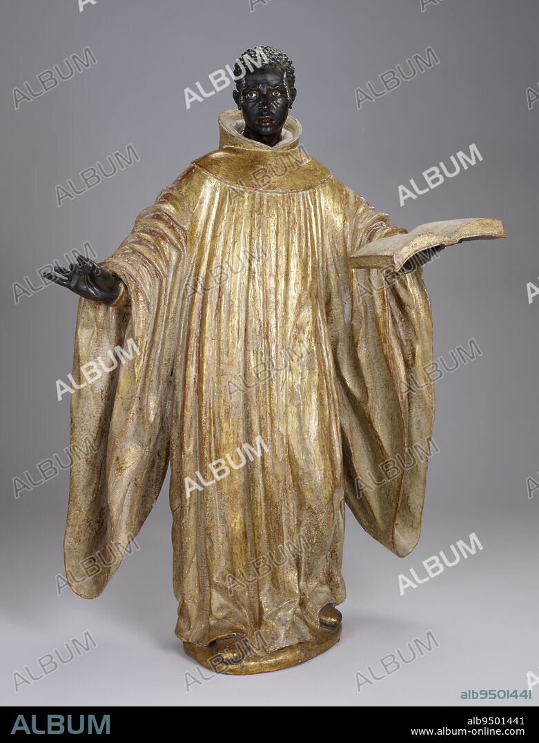 Saint Benedict of Palermo, c. 1734, Attributed to José Montes de Oca, Spanish, c. 16751750, 49 x 34 5/8 x 16 1/2 in. (124.46 x 87.95 x 41.91 cm), Polychrome and gilt wood, glass, Spain, 18th century, Saint Benedict of Palermo (1524-1589) was the first Christian saint of African origin to be canonized in modern times. He was born in Sicily (then part of Spain) of parents who were freed slaves, and who were said to have come from Ethiopia. Saint Benedict was admired as a model of extraordinary religious devotion, wise counsel and spiritual leadership. After his death a grassroots movement to make him a saint ensued. By the early 1600s Saint Benedict was widely venerated in Italy, Spain, and Latin America. José Montes de Oca's statue, carved in Sevilla in the 1730s, masterfully captures Saint Benedict's charismatic personality. The glass eyes and bone teeth add to the saint's life like quality. Yet it is the concentrated facial expression, Benedict's welcoming gesture of his spread arms, the movement of his cowl and his contrapposto stance, by which Montes de Oca renders the saint's inspiration within the statue's every inch.