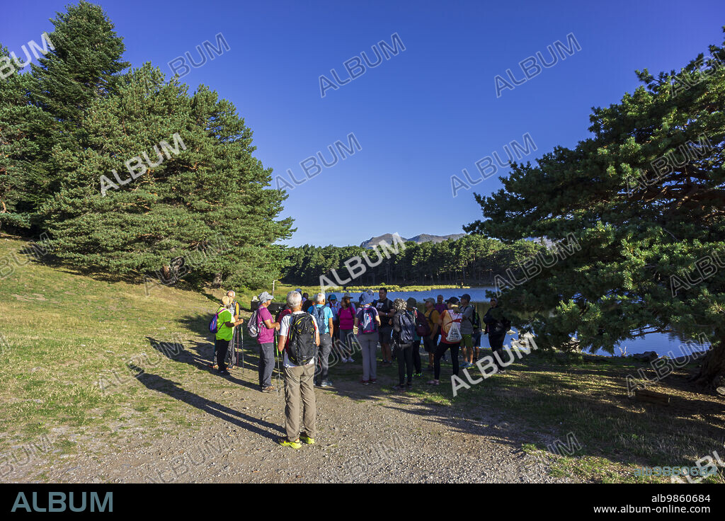 senior trekking group, Bassa d'Oles, Montcorbison, Aran Valley, Lérida province, Spain.