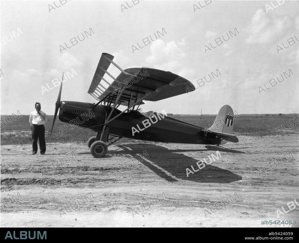Hartley Soule with Fairchild 22, Langley Field, Virginia, USA, April 25, 1932. American aerospace engineer Hartley Soule stands in front of a Fairchild 22 monoplane with a leading edge high lift device installed for flight testing. This was the first of three Fairchild 22s to be used by the NACA at Langley. This Fairchild 22 showed no aircraft number in the NACA shield on the rudder, although as the NACA fleet expanded, the number appearance became a requirement.
