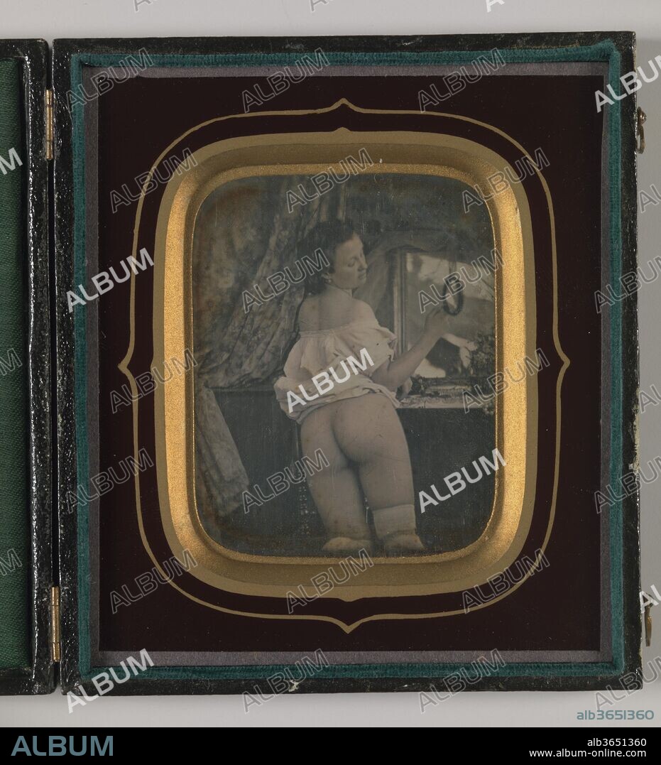 [Nude with Mirror]. Artist: Unknown (French). Dimensions: visible: 7 x 5.7 cm (2 3/4 x 2 1/4 in.). Date: ca. 1850.
Censors have long struggled to keep pace with evolving technology and expanding distribution networks of photographic erotica. In nineteenth-century France, government officials regularly seized thousands of photographs similar to the daguerreotype displayed here, which were deemed lewd. 
Male nudity has frequently been subject to stricter control than pornography featuring women. The Arcadian photographs of Plüshow and his cousin and student Wilhelm von Gloeden were avidly collected in the late nineteenth century, but in the 1930s many of their prints and negatives, considered deviant by the Italian Fascist government, were destroyed. For much of the twentieth century, it was illegal in the United States to mail photographs that might be judged prurient, forcing photographers to mask genitalia and pubic hair with strategic props or with overpainting that could be easily removed by purchasers. Sale of erotic male physique magazines and bodybuilder pin-ups, ostensibly circulated to promote fitness, was legalized in a 1962 Supreme Court ruling, which concluded that "portrayals of the male nude cannot fairly be regarded as more objectionable than many portrayals of the female nude that society tolerates.".