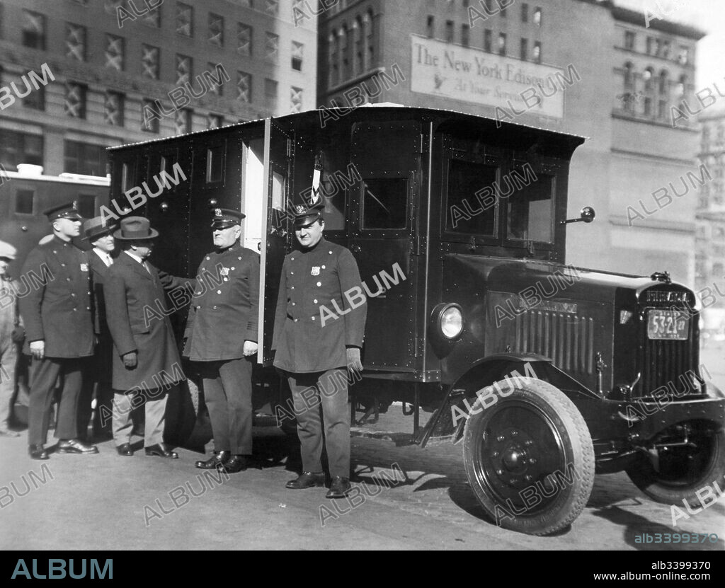 New York, New York:  November 11, 1926 New York City Comptroller General Charles Berry inspects the new armored cars that will be used to transport the city's moneys. A special police car will also be assigned to each armored car.