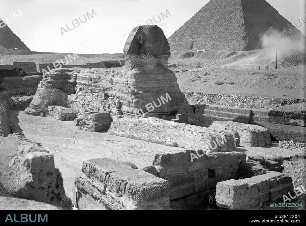 The Great Sphinx of Giza is a limestone statue of a reclining sphinx (a mythical creature with a lion's body and a human head) that stands on the west bank of the Nile. It is the largest monolith statue in the world, standing 241 feet long, 63 feet wide, 66 feet high. It is the oldest known monumental sculpture, and is commonly believed to have been built by ancient Egyptians of the Old Kingdom during the reign of the Pharaoh Khafra (2558-2532 BC). Photograph taken by the American Colony (Jerusalem) Photo Department, circa 1934-39. Title and date from: photographer's logbook: Matson Registers, v. 1.
