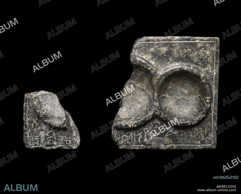Libation table fragment; corner and part of two circular receptacles, c2325-c2175BC. Linear A incription; the left hand corner was acquired in 1898 by Demargne and is now in the Louvre (IPS 358), Middle Minoan III Period - Late Minoan I Period. Corner and part of two circular receptacles; Linear A incription; the left hand corner was acquired in 1898 by Demargne and is now in the Louvre (IPS 358). Dimensions: width: 19.6 cmheight: 8.5 cmlength: 14 cm.