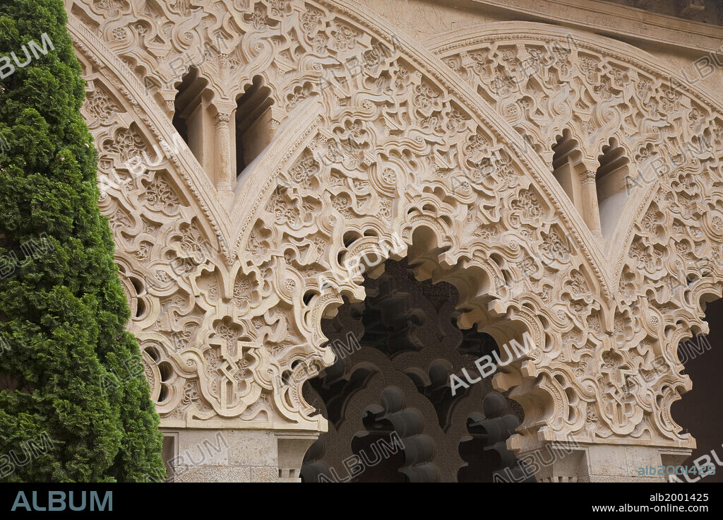 The Aljaferia Palace is a fortified palace that was built during the second half of the 11th century in Zaragoza by Abu Jafar Ahmad ibn Sulayman al Muqtadir billah (1046/7-1081/82), as the residence of the Banu Hud dynasty. It was originally named "Dar al Surur" ("House of Joy"). The name Aljaferia derives from "al-Jafariyya", after the name of its founder. The structure holds unique importance in that it is the only conserved testimony of a large building of Spanish Islamic architecture in the era of the Taifas (independent Islamic kingdoms). The most remarkable feature of the Aljaferia is in the systems of interlacing arches with a high degree of complexity. In 2001 Aljaferia Palace was added to the category of Mudejar Architecture of Aragon, that was declared World Heritage by UNESCO.