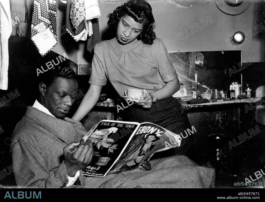With his Fiancee, Marie Ellington, Cole reads reports of his wedding plans. September 23, 1948. (Photo by France Media Agency).