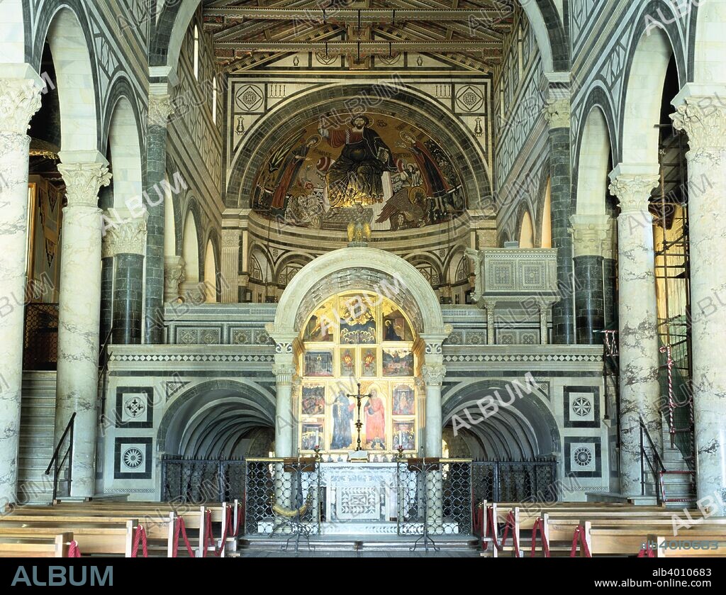 Interior of the Basilica of San Miniato al Monte, Florence, Italy. View towards the altar, above which the apse is dominated by a large mosaic depicting Christ between the Virgin Mary and St Minias dating from the late 13th century. San Miniato al Monte is regarded as one of the finest examples of Romanesque architecture in Tuscany.