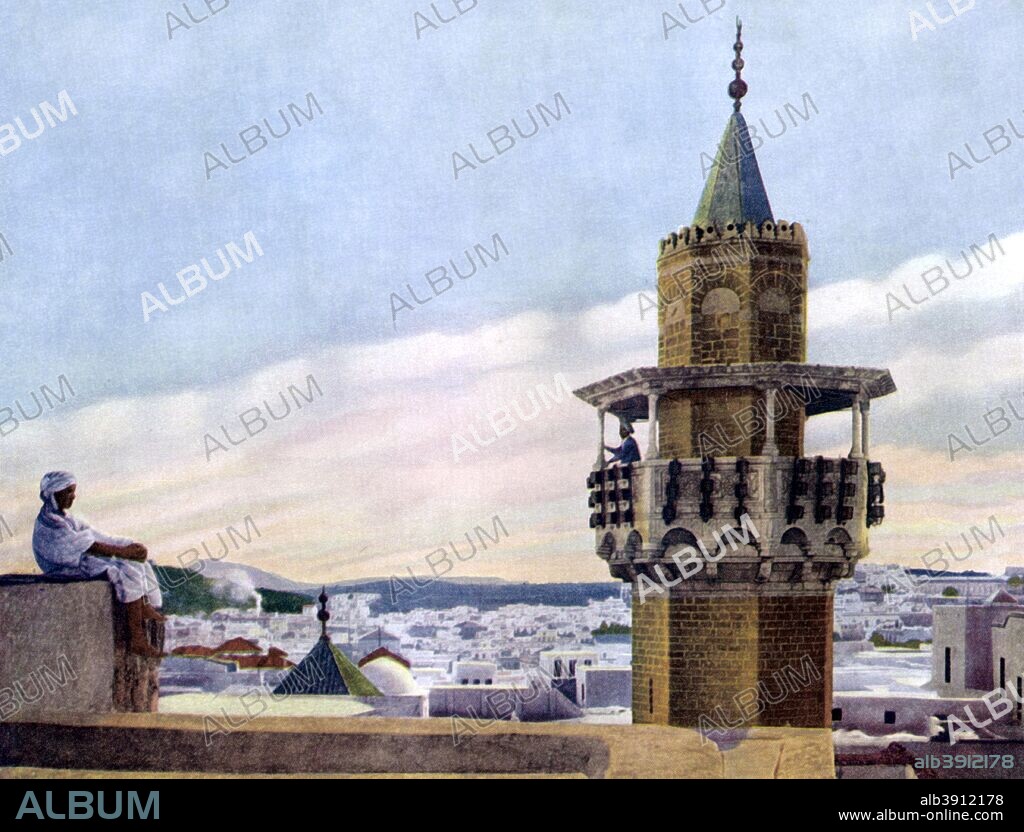 'The Muezzin in his Minaret calling the Faithful to Prayer', 1926. The muezzin is a chosen person at the mosque who leads the call (adhan) to Friday service and the five daily prayers (also known as the salat) from one of the mosque's minarets (in most modern mosques, electronic amplification aids the muezzins). From An Outline of Christianity, The Story of Our Civilisation, volume 5: Christianity Today and Tomorrow, edited by RG Parsons and AS Peake, published by the Waverley Book Club (London, 1926).