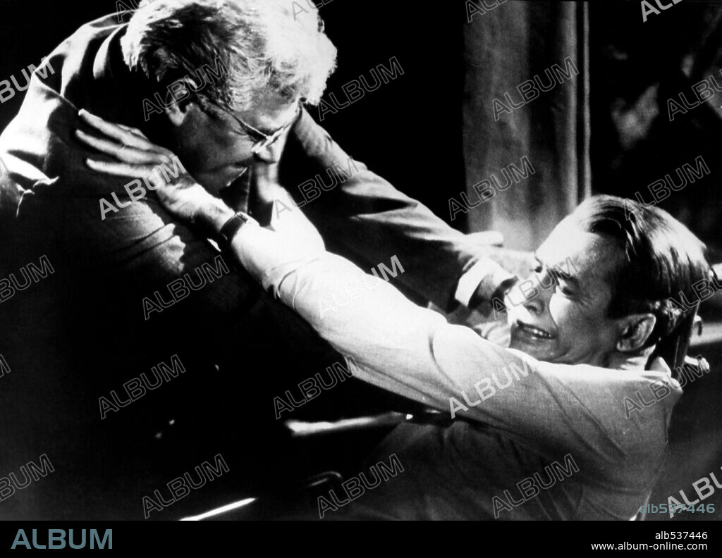 JAMES STEWART and RAYMOND BURR in REAR WINDOW, 1954, directed by ALFRED HITCHCOCK. Copyright PARAMOUNT PICTURES.