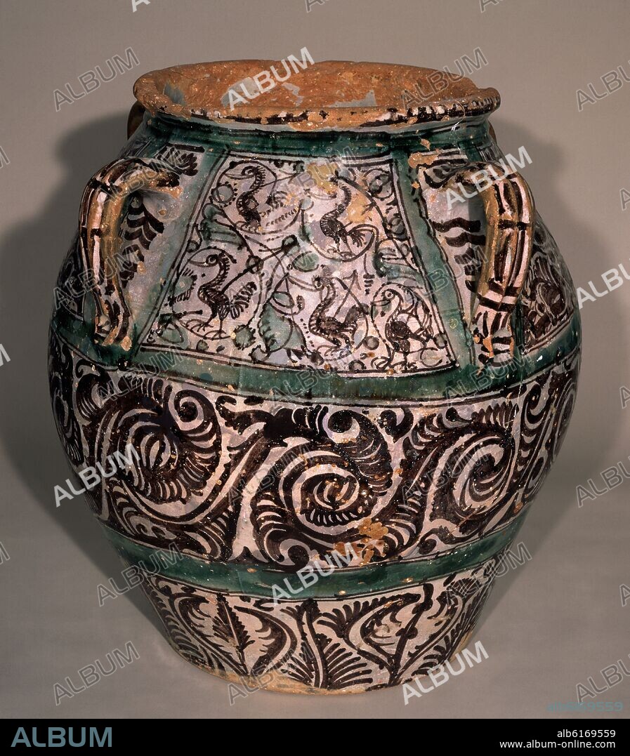 ORZA TUROLENSE CON ASAS DECORADA CON PALMETAS DERIVADAS DE LOS ATAURIQUES CARNOSOS DE MANISES, Y PAJAROS ESTILIZADOS - SIGLO XV.