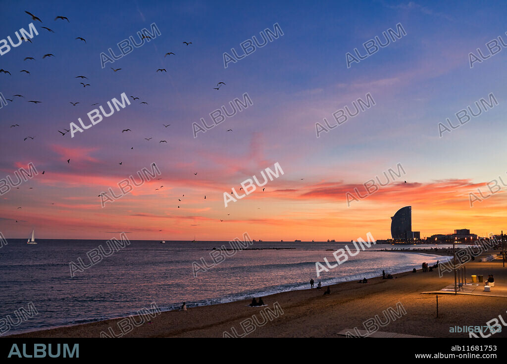 Sunset at Barceloneta Beach, In the background Hotel W, Barcelona, Catalonia, Spain.