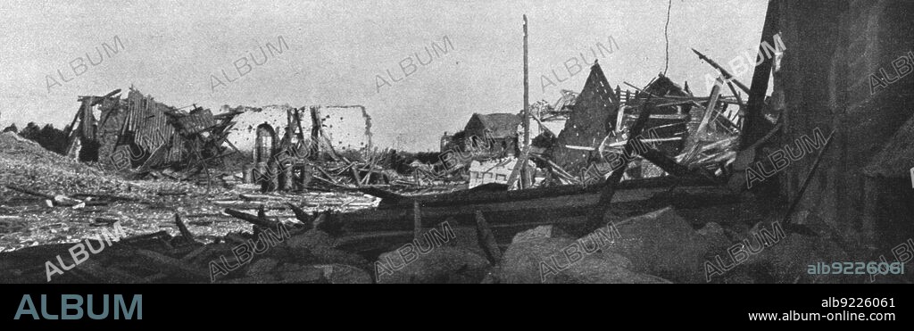 'La Bataille de la Somme; Dans les ruines de Biaches: au centre, derriere le poteau du telegraphe, une petite chapelle dont les Allemands avaient fait un reduit puissamment fortifie', 1916. From "Collection de la Guerre IV. L'Illustration Tome CXLVIII. La Guerre Juillet, Aout, Septembre, Octobre, Novembre, Decembre 1916".