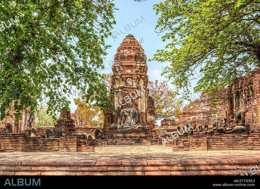 Temple complex with stupa and large Buddha statue, Wat Mahathat, Ayutthaya, Wat Chang Phra Nakhon Si Ayutthaya, Thailand, Asia.