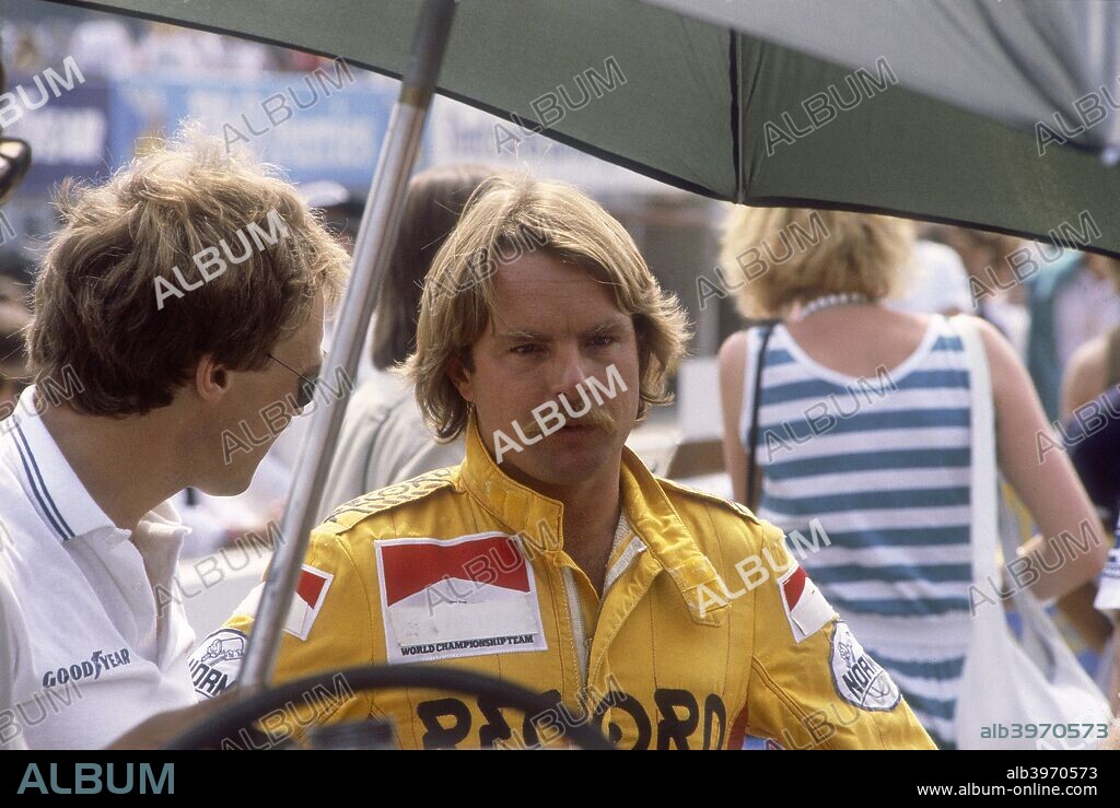 Keke Rosberg at the British Grand Prix, Brands Hatch, Kent, 1982. Although he had shown considerable talent in the lower echelons of motor racing, Rosberg took a long time to register success in Formula 1, being hampered by uncompetitive cars in his first four seasons. However, when Alan Jones retired in 1981, Rosberg was chosen to be his replacement with the Williams team. He only achieved one victory for them in 1982, in France, but his consistent performances gained him sufficient points to win the World Championship. He drove for Williams until the end of the 1985 season, winning four more Grands Prix, before switching to McLaren for his last campaign in 1986. A colourful personality, Rosberg was best known for his ability to win races in particularly difficult conditions, as on a drying track at Monaco in 1983, and in extreme heat at Dallas the following year.