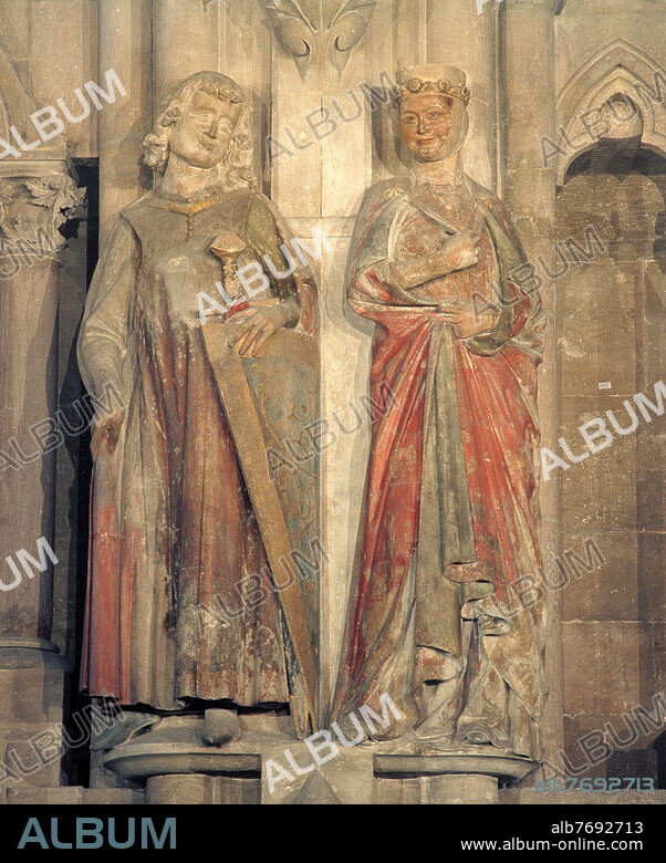 Naumburg (Sachsen-Anhalt), Dom St. Peter und Paul, Westchor. - Stifterfiguren des Markgrafen Hermann und seiner Gemahlin Reglindis. - (Hermann I., Markgraf von Meißen; um 980 - 1. 11. 1038, und seine Gemahlin Reglindis, Tochtes des polnische Königs Boleslaw I., um 988/989-1014). Skulpturen, Naumburg, Naumburger Meister, zwischen 1243 und 1249. Kalkstein, mit Fassung, Hermann Höhe 180 cm, Breite 65 cm, Tiefe 40 cm, Reglindis Höhe 178 cm, Breite 58 cm, Tiefe 38 cm. Aus der Reihe der zwölf Stifterfiguren im Westchor des Naumburger Domes, Übergang vom Chorjoch (Quadrum) zum Polygon, südliche Innenwand.