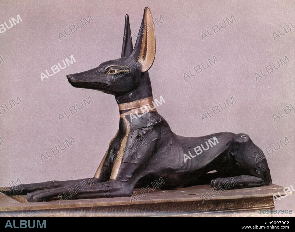 Tutankhamen in the form of the dog Anubis during the course of his transformations. Tukankhamen, by Christiane Desroches Noblecourt, page 252. Anubis, is the Greek name for the ancient god of the underworld in Egyptian mythology, who guided and protected the spirits of the dead. The hieroglyphic is more accurately spelt Anpu (also Anup, Anupu, Wip, Ienpw, Inepu, Yinepu, or Inpw). Prayers to Anubis have been found carved on the most ancient tombs in Egypt. Anubis was painted black to further link him with the deceased - a body that has been embalmed became a pitch black colour. Black was also the colour of fertility, and thus linked to death and rebirth in the afterlife.