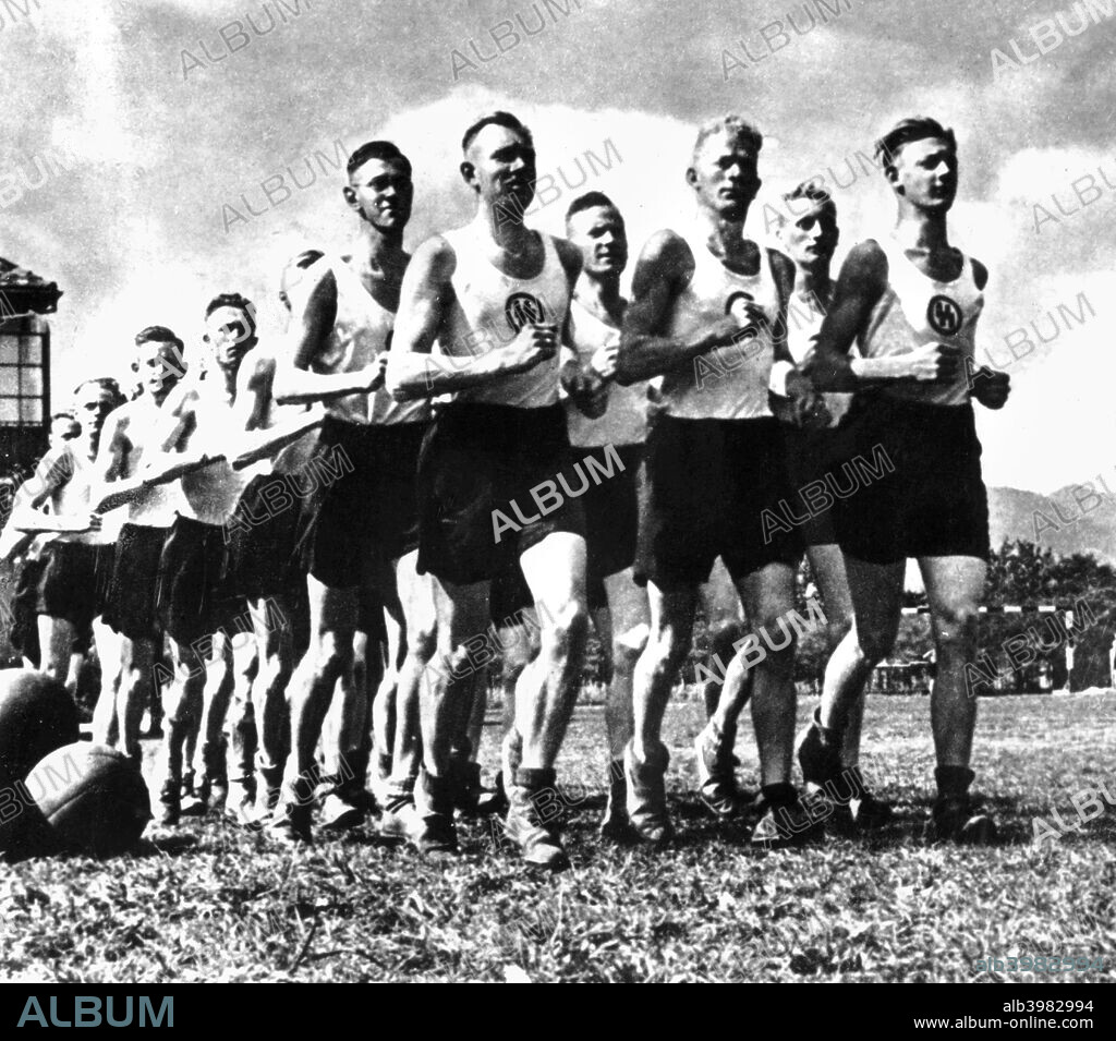 Members of the Nazi SS keeping fit, c1939-1945. From a propaganda poster.