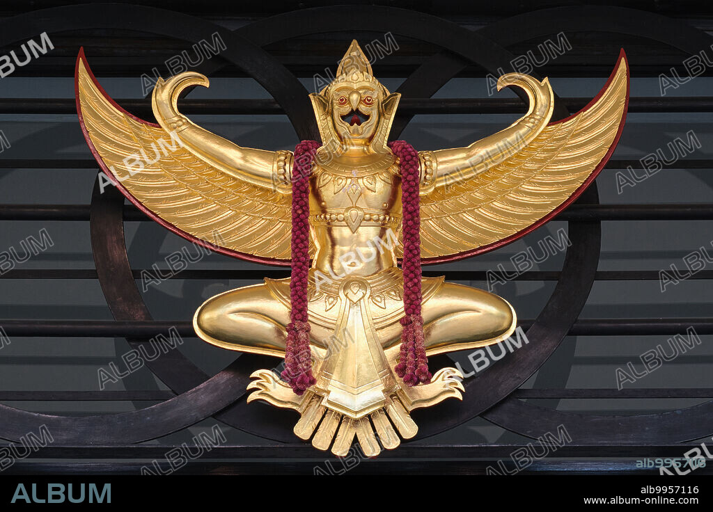 Thailand: A Khrut (Krud) or Garuda bird, the vehicle of the Hindu God Vishnu and a symbol of the Thai monarchy, here seen over the entrance to the Sala Chalermkrung Royal Theatre, Bangkok.<br/><br/>. The Phra Khrut Pha is the national emblem of Thailand and was first adopted as that in 1911 by King Vajiravudh (Rama VI). The symbol can be applied for by Thai companies and issued as a royal warrant of appointment.