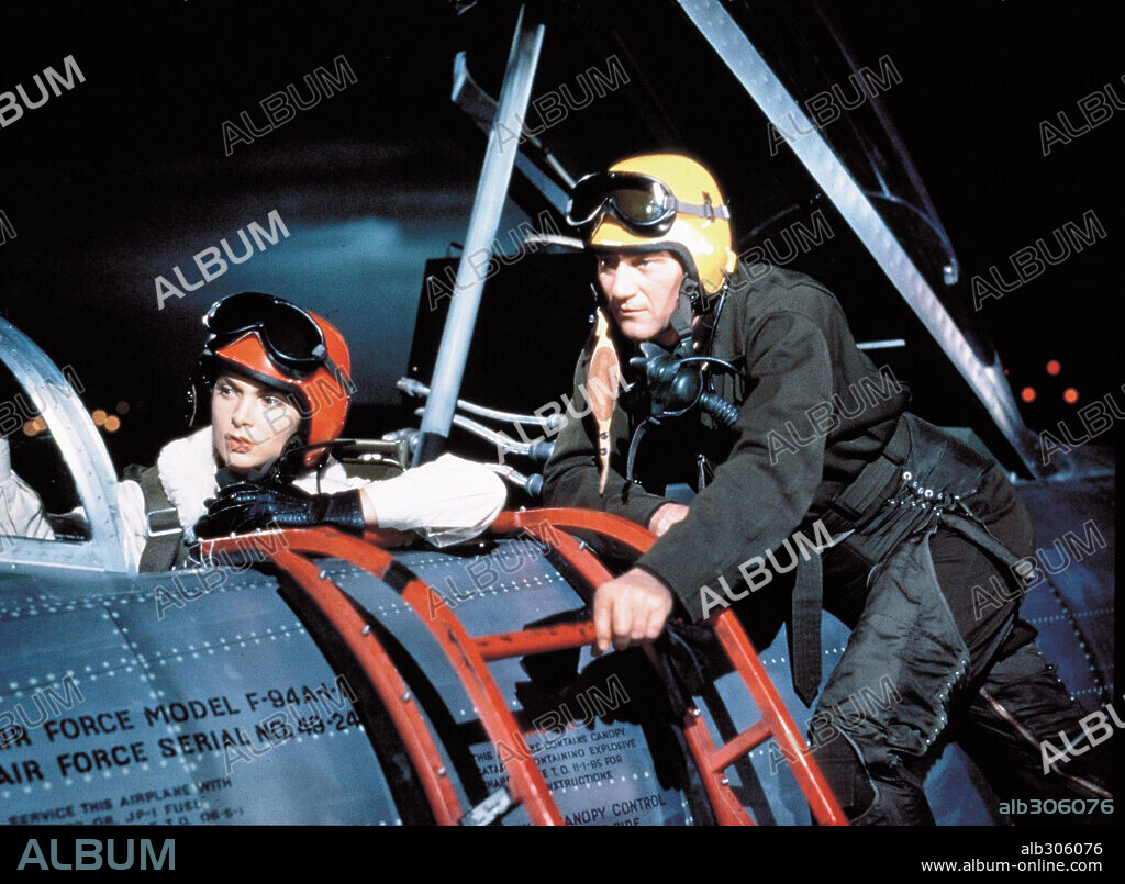 JANET LEIGH and JOHN WAYNE in JET PILOT, 1957, directed by JOSEF VON STERNBERG. Copyright RKO.