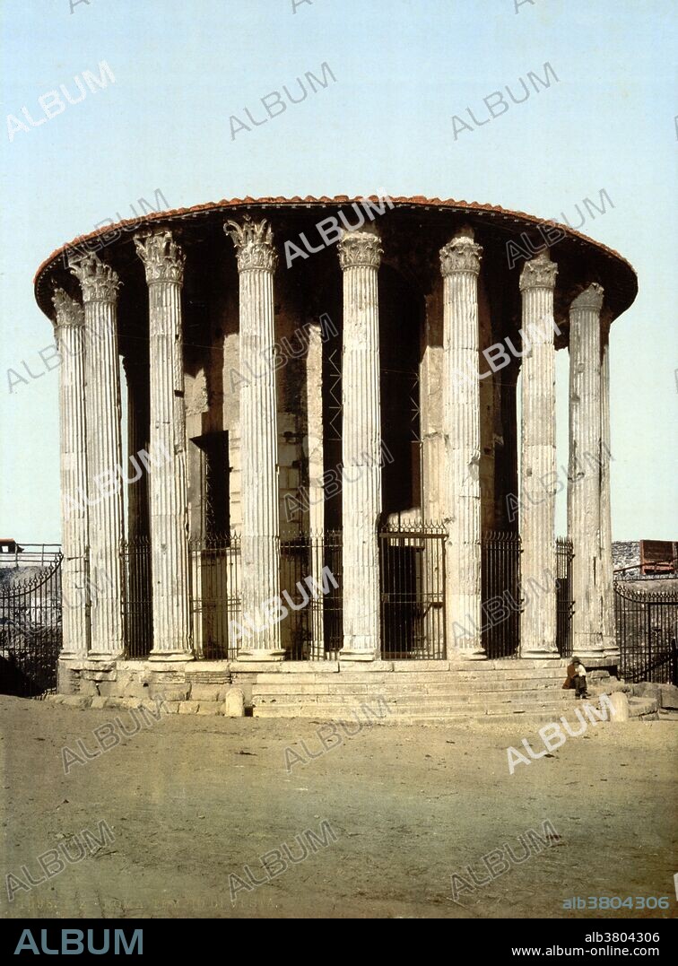 The Temple of Hercules Victor is an ancient edifice located in Piazza Bocca della VeritÃ , in the area of the Forum Boarium close to the Tiber in Rome. It is a monopteros, a round temple of Greek peripteral design completely encircled by a colonnade. This layout caused it to be mistaken for a temple of Vesta until it was correctly identified by Napoleon's Prefect of Rome, Camille de Tournon. Dating from the later 2nd century BC, and perhaps erected by L. Mummius Achaicus, conqueror of the Achaeans and destroyer of Corinth, the temple is 48.5 feet in diameter and consists of a circular cella within a concentric ring of twenty Corinthian columns 35 feet tall, resting on a tuff foundation. These elements supported an architrave and roof, which have disappeared. The original wall of the cella, built of travertine and marble blocks, and nineteen of the originally twenty columns remain but the current tile roof was added earlier. The temple is the earliest surviving marble building in Rome. Detroit Publishing Company circa 1890-1900.