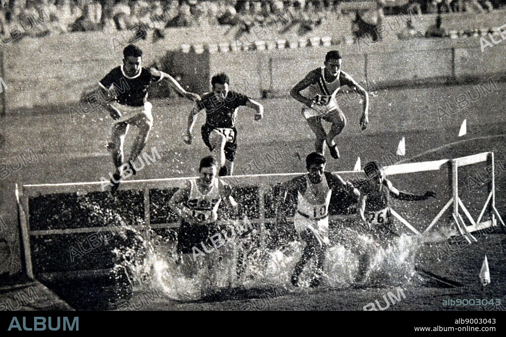 Photograph of the 3000 Meter Steeplechase during the 1932 Olympic games. Won by Volmari Iso-Hollo (1907 - 1969) from Finland. Volmari was one of the last Flying Finns who dominated long distance running. Volmari broke the world record at 09.09.4.