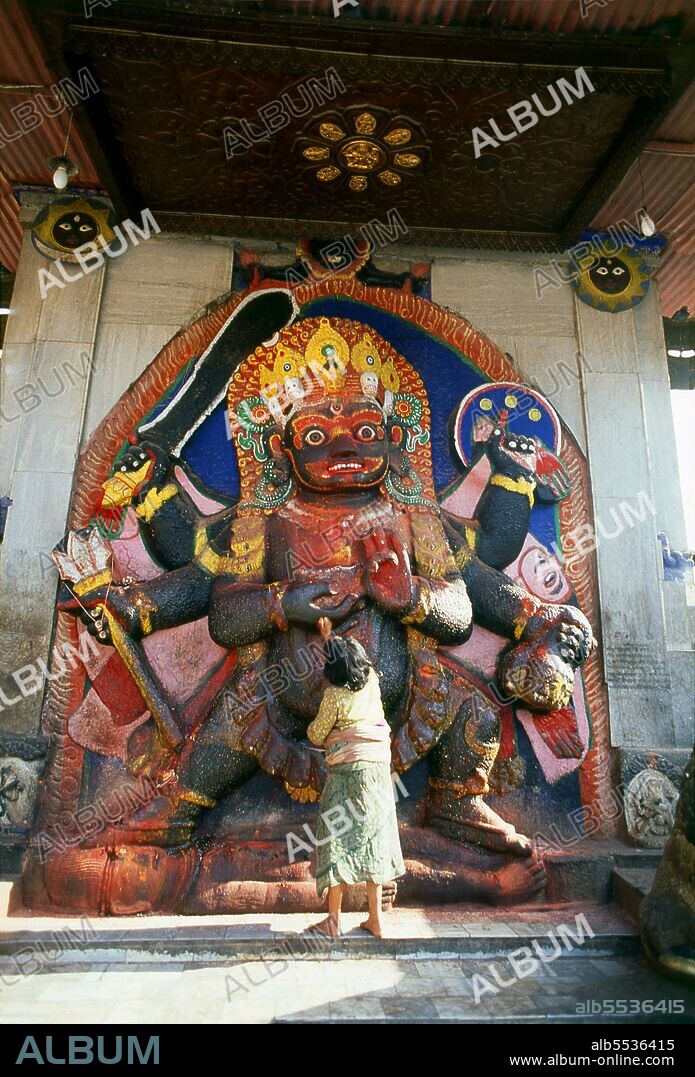 The Kala Bhairav or Black Bhairav is a 3m-high statue depicting a sword-wielding, terror-inducing manifestation of Shiva trampling on some unfortunate victim. Local lore has it that the image was found on the Nagarjun mountain on the western rim of the Kathmandu Valley and brought to its current place by King Pratapa Malla. Once the image was set up in Durbar Square, royal courtiers had to swear oaths of allegiance in front of it and witnesses in criminal cases had to testify in its presence. It was believed that anybody telling lies in front of Kala Bhairav would immediately die. Kala Bhairav also demanded blood sacrifices and until today numerous animals are slaughtered in front of the figure during the festival of Dassain. Bhairava sometimes known as Kala Bhairava, is a Hindu deity, a fierce manifestation of Shiva associated with annihilation. He originated in Hindu mythology and is sacred to Hindus, Buddhists and Jains alike. He is worshipped in Nepal, Rajasthan, Karnataka, Tamil Nadu and Uttarakhand.