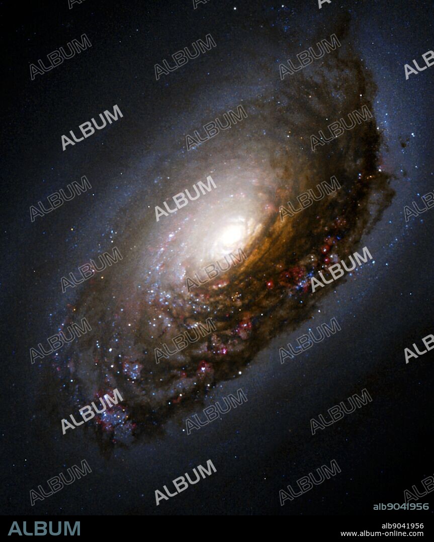 Dust Band Around the Nucleus of 'Black Eye Galaxy' M64. A collision of two galaxies has left a merged star system with an unusual appearance as well as bizarre internal motions. Messier 64 (M64) has a spectacular dark band of absorbing dust in front of the galaxy's bright nucleus, giving rise to its nicknames of the 'Black Eye' or 'Evil Eye' galaxy. M64 resides roughly 17 million light-years from Earth. At first glance, M64 appears to be a fairly normal pinwheel-shaped spiral galaxy. As in the majority of galaxies, all of the stars in M64 are rotating in the same direction, clockwise as seen in the Hubble image. However, detailed studies in the 1990's led to the remarkable discovery that the interstellar gas in the outer regions of M64 rotates in the opposite direction from the gas and stars in the inner regions.