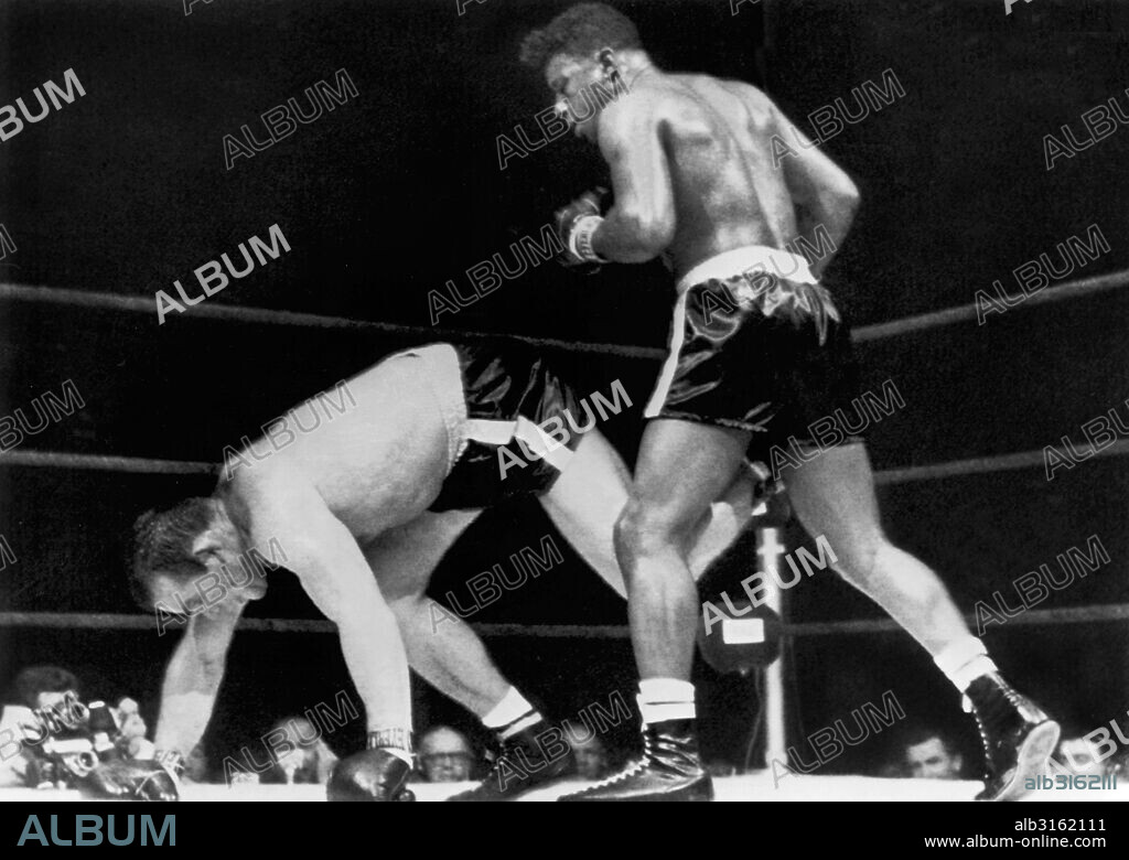 Miami Beach, Florida: March 13, 1961. Heavyweight champion Floyd Patterson retains his title as he stands over a fallen Ingemar Johansson. Johansson was unable to get up and Patterson won with the sixth round knockout.
