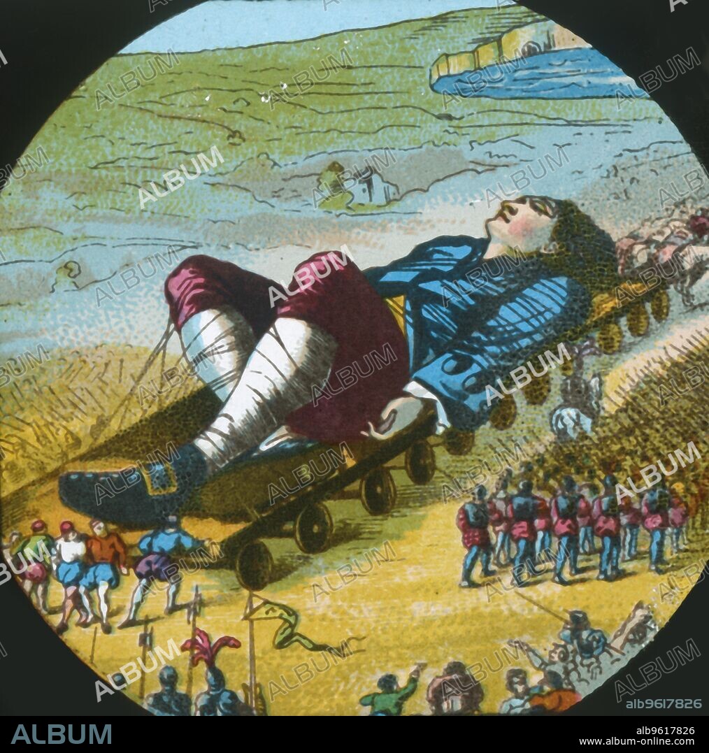 The Lilliputians convey the sleeping Gulliver to their city, lantern slide, late 19th century. 'Fifteen hundred of the emperor's largest horses, each about four inches and a half high, were employed to draw me towards the metropolis, which, as I said, was half a mile distant'. A scene from "Gulliver's Travels" by Jonathan Swift, first published in 1726. One of a series of 12 'Superior Lithographic Coloured Lantern Slides...with Lecture complete', made in England c1870-1900.