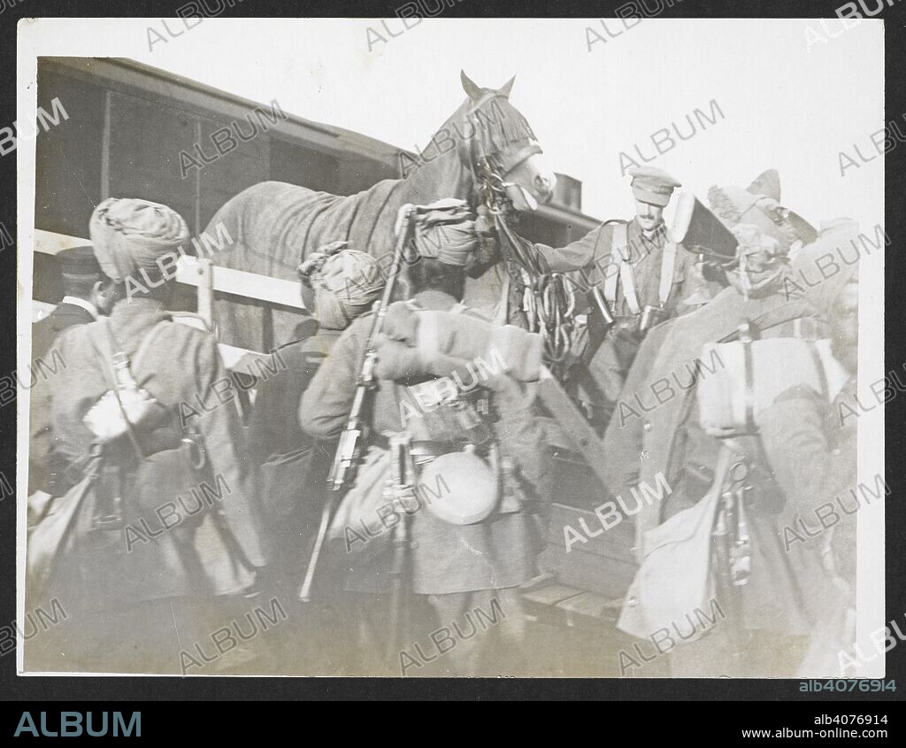Unloading officers' chargers [France]. Indian cavalry mounts being disembarked from a train. 6 September 1915. Record of the Indian Army in Europe during the First World War. 20th century, 6 Sep 1915. Gelatin silver prints. Source: Photo 24/(353).