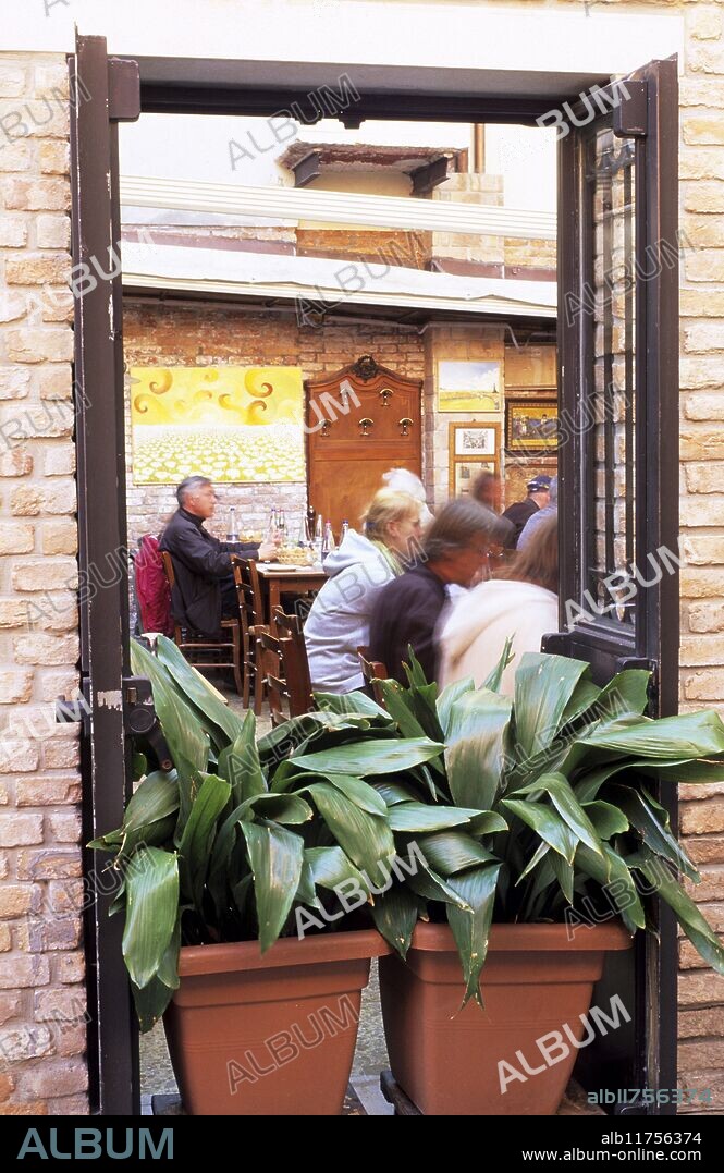 "Casin di Nobili restaurant, view of interior through window, people dining." *** Local Caption ***.