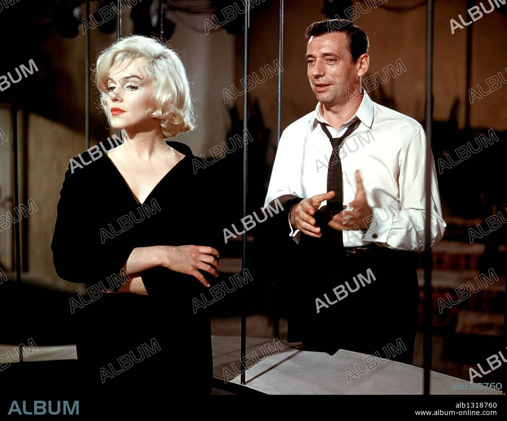 NORMA JEAN BAKER und YVES MONTAND. MARILYN MONROE und YVES MONTAND in LET'S MAKE LOVE, 1960, unter der Regie von GEORGE CUKOR. Copyright 20TH CENTURY FOX.