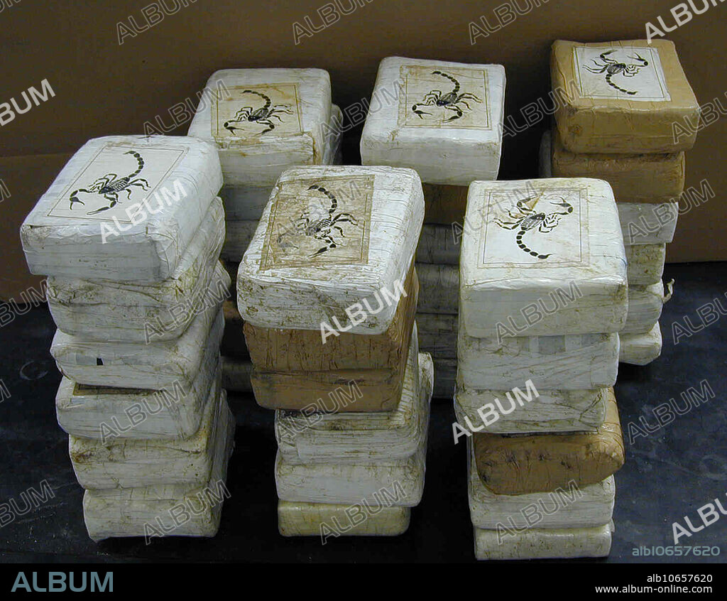 Seized Cocaine Bricks, Scorpion Logo. Symbols, names, and numbers are used to mark territory. It is a calling card or advertisement so to speak. Scorpion is Colombian. Cocaine is a powerfully addictive central nervous system stimulant that is snorted, injected, or smoked. Cocaine is a strong central nervous system stimulant that increases levels of dopamine, a brain chemical (or neurotransmitter) associated with pleasure and movement, in the brain's reward circuit. Cocaine usually makes the user feel euphoric and energetic, but also increases body temperature, blood pressure, and heart rate. Users risk heart attacks, respiratory failure, strokes, seizures, abdominal pain, and nausea. Street names include: coke, snow, flake and blow.