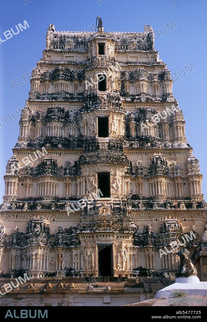 The Virupaksha Temple (also known as the Pampapathi Temple) is Hampi's main centre of pilgrimage. It is fully intact among the surrounding ruins and is still used in worship. The temple is dedicated to Lord Shiva, known here as Virupaksha, as the consort of the local goddess Pampa who is associated with the Tungabhadra River. Hampi is a village in northern Karnataka state. It is located within the ruins of Vijayanagara, the former capital of the Vijayanagara Empire. Predating the city of Vijayanagara, it continues to be an important religious centre, housing the Virupaksha Temple, as well as several other monuments belonging to the old city.
