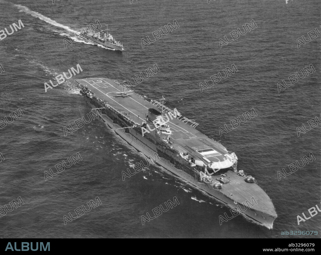 The aircraft carrier H.M.S. Glorious with its escort destroyer H.M.S. Wishart. 1939.