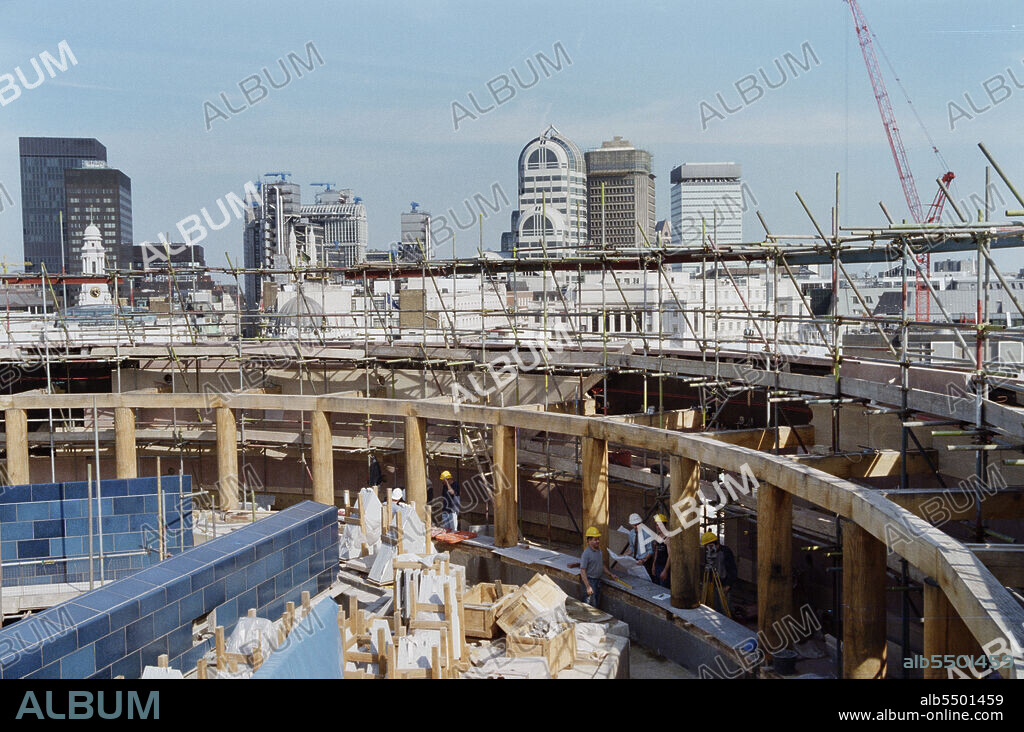 JOHN LAING PLC. No 1 Poultry, City of London, c1996. The internal timber colonnade of the central circular roof garden during construction at No. 1 Poultry, London.  Showing the rooftops of the buildings to the east beyond.