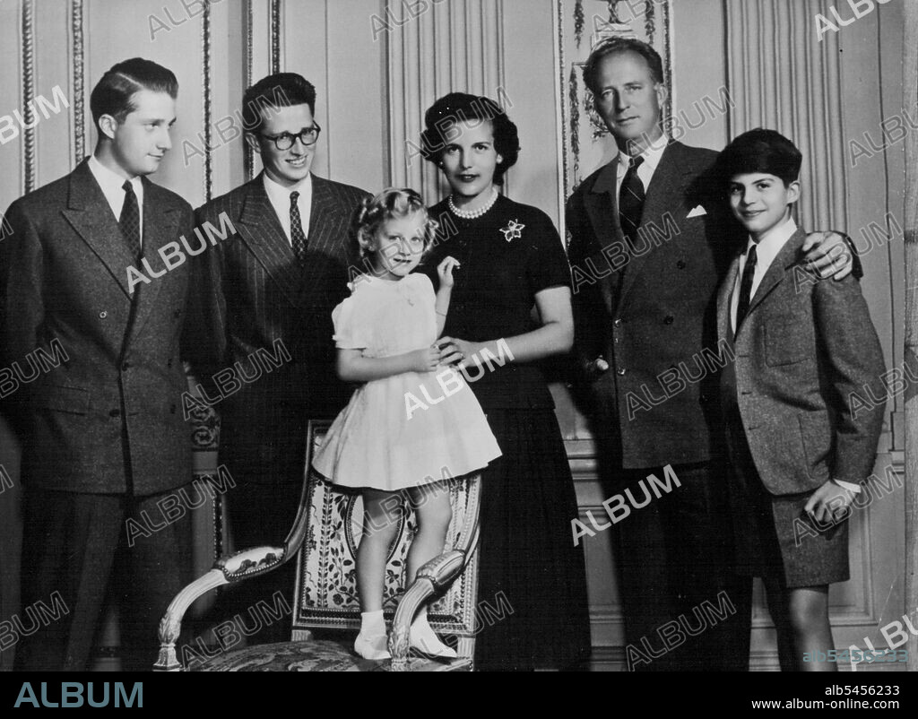 The Royal Family Of Belgium - Albert of Liege; King Baudouin of the Belgians; Princess Marie-Christine (standing on chair); Princess Liliane De Rethy; ex-King Leopold; and Prince Alexander. This study was taken at the Palace of Laeken. - Prince Alexander and Princess Marie- Christine, the children of ex-King Leopold's marriage to Princess  De Rethy  Which took place in 1941, are not in line of succession to the throne of Belgium. January 10, 1955. (Photo by Camera Press).