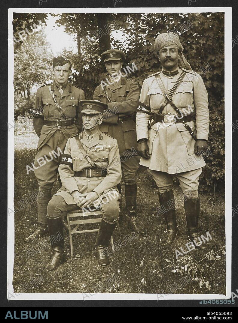 H. D GIRDWOOD. Gen. Sir James Willcocks and his personal staff in the garden at his headquarters [Merville, France]. Full-length seated portrait, in uniform, with the three members of his personal staff standing behind him. Sirdar Bahadur Khwaja Mahomed stands at the right. 31 July 1915. Record of the Indian Army in Europe during the First World War. 20th century, 31 July 1915. Gelatin silver prints. Source: Photo 24/(186).