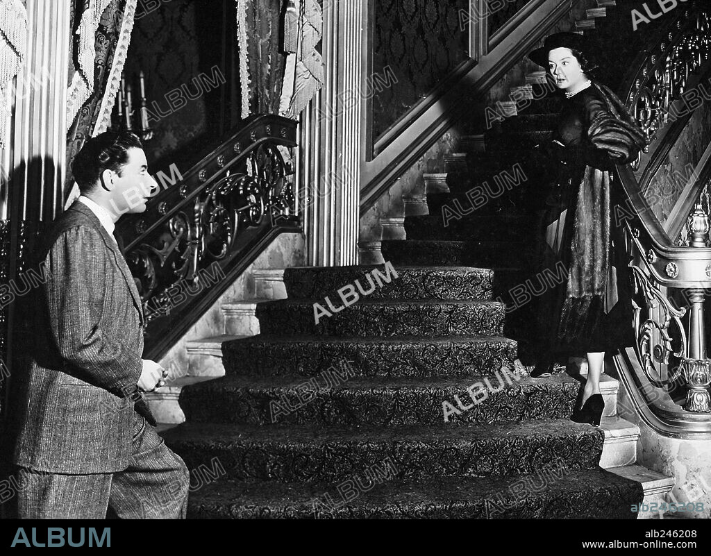 LEO GENN and ROSALIND RUSSELL in THE VELVET TOUCH, 1948, directed by JOHN GAGE. Copyright RKO.