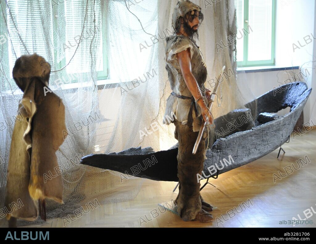 Poland. Prehistory. Neolithic. Recreation of a hunter and his dress. Temporary exhibition "The Hunters Settlement Fok from the Stone Age in the Gulf of Puck" (March-June 2015). Archaeological Museum. Gdansk. Poland.