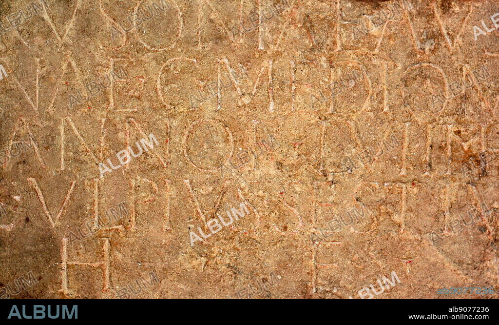 Fragment from an Roman gravestone. Inscribed in Latin with: "To the spirits of the departed, Mercatilla, freedwoman and foster-daughter of Magnius. Lived 1 year, 6 months, 12 days. This child was born a slave. In her short life she was adopted and granted freedom." Circa 1st-4th century AD.